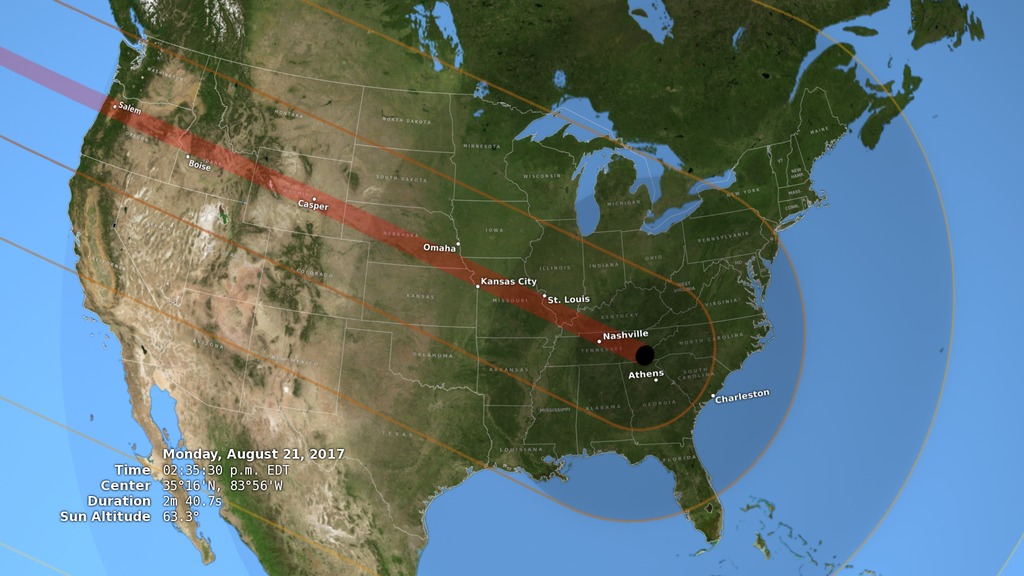 Illustration showing the United States during the total solar eclipse of August 21, 2017, with the umbra (black oval), penumbra (concentric shaded ovals), and path of totality (red) through or very near several major cities.